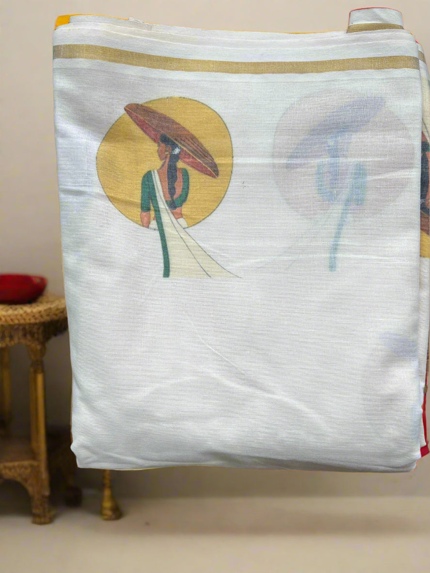 White fabric with a colorful embroidered design of a person holding an umbrella on a wooden surface.